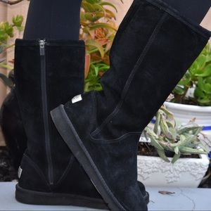 Tall black UGG boots